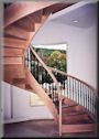 Custom 10' 10" diameter with closed risers, cast iron baluster, and USS-20 profiled rails